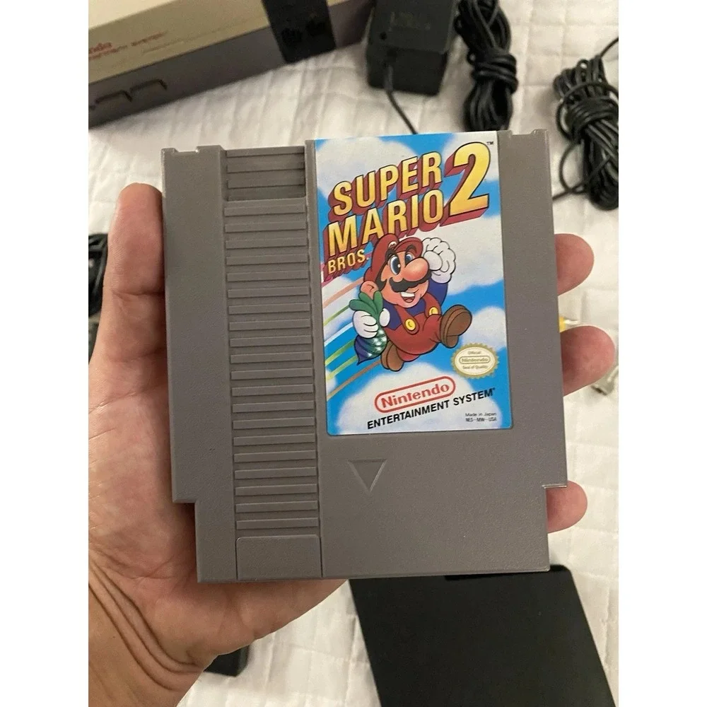 authentic NES Console Bundle with Super Mario Bros. 1,2,3 and 2 Controllers gun